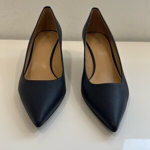 Brand new Michael Kors 2” navy blue leather pumps. Size 10M